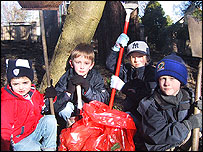 children with rakes and brushes
