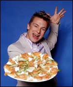 Jamie Oliver with a plate of food