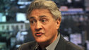 John Suchet being interviewed in a studio