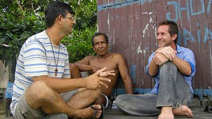 Padre Volnei talks to Bruce