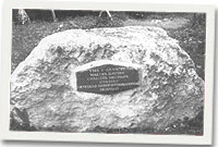 Darn o garreg galch gyda'r plac arno ar safle Y Wern, Llanfechain