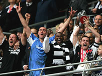 Matt Oakley Captain of Derby County holds the trophy aloft after winning the Championship play-off final match
