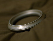 A simple, plain circular steel bracelet