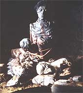 A mummy on a pile of rocks from a cave in South Uist