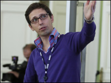 Dmitry Shishkin giving a talk on multiplatform journalism and audience habits