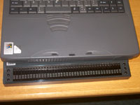 Close-up of the Braille display attached to Liz's laptop