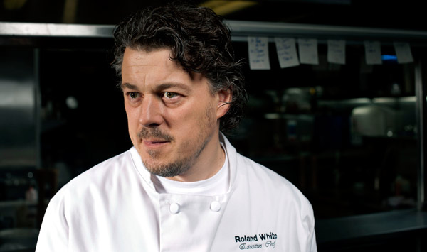 Alan Davies as Roland