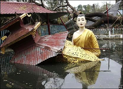 A large statue of Buddha sits in a pool of water ata temple on the outskirts of Rangoon