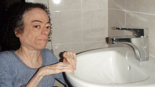 Liz Carr beside her new sink