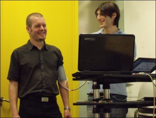 Course tutor Ashley Hall tries on a haptic device based on a blood pressure cuff