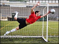 Goal keeper saving a ball
