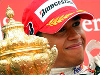 Lewis Hamilton celebrates winning the British GP