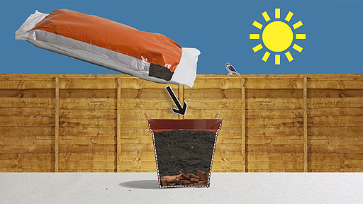 A cross section of pot showing broken crocks in the bottom.