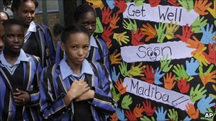 Children outside the hospital where Nelson Mandela is being treated leaving get well messages