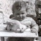Anne's brother Brian, 1954. Anne's father was a carpenter and made the baby chair in the picture