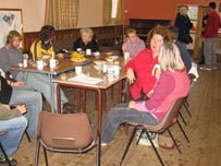 People in church hall eating lunch