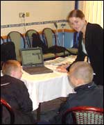 Amy Elias from the BBC Coventry website working with pupils from Woodway Park School