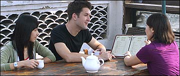 A girl recommends food at a restaurant