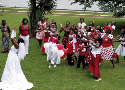 Women try to catch a bride's bouquet