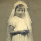 Marie in her First Holy Communion dress, aged 6