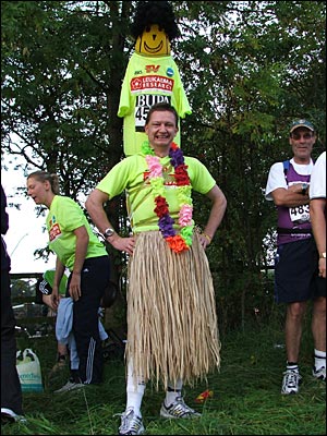 Runner in grass skirt costume