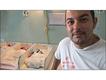 Midwife Felipe Rojas Lopez in a room full of seriously ill newborn babies. 