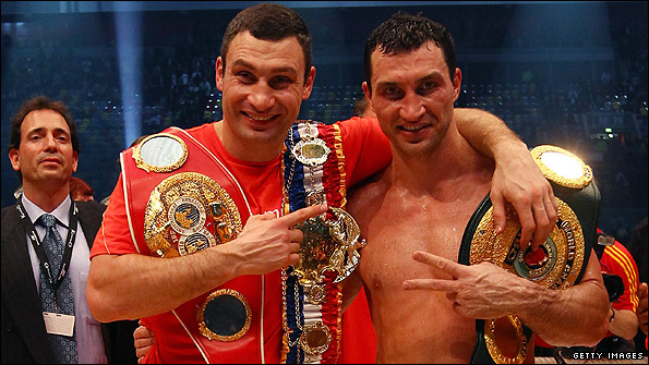 The Klitschko brothers parade their world heavyweight belts.jpg