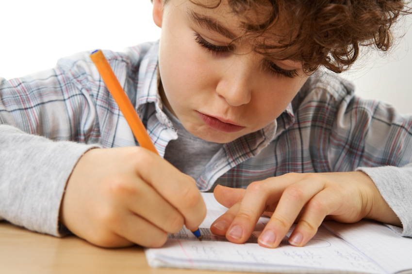 Young boy doing homework @ Jacek Chebraszewski - fotolia