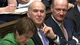Business Secretary Vince Cable watches the Chancellor deliver the Budget
