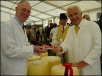 two men judging cheese