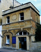 Modest two-storey terraced stone building