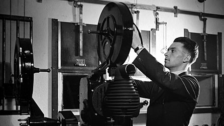 Photograph of a technician and a camera