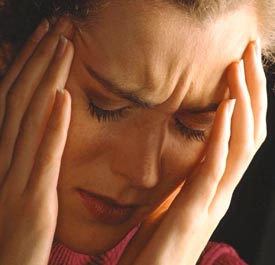 A woman with an anxious expression