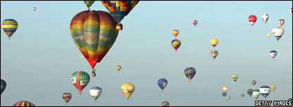 Lots of hot air balloons in the sky