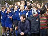 Dan Hipkiss with young rugby players in Diss