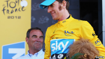 Bradley Wiggins of Great Britain and SKY Procycling smiles, as 5 times Tour de France winner Bernard Hinault looks on