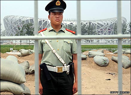 A paramilitary guard in front of the Olympic Stadium in Beijing