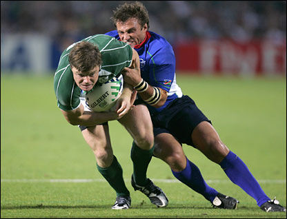 Ireland's center Brian O'Driscoll is tackled by Namibia's centre Piet van Zyl