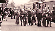 Crew members wait to go aboard the train