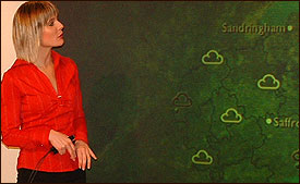 Picture: Julie in front of the weather map.