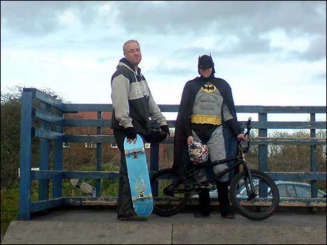 Man with a skateboard and 'Batman' 470
