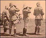 Officers observing the war