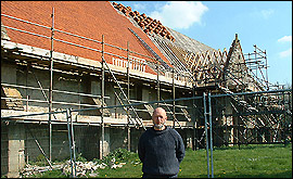 Michael Eavis outside the 12th Century Tithe Barn