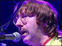 Neil Harrison as John Lennon