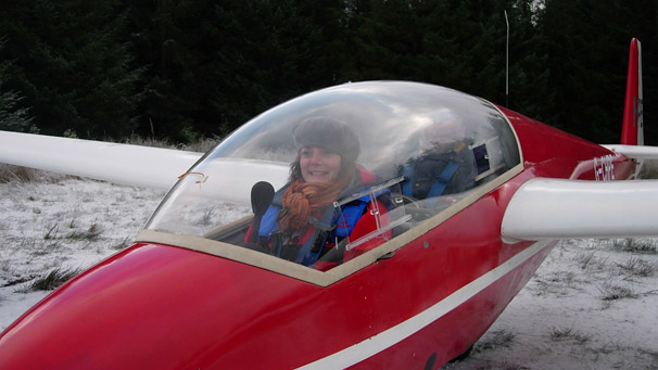 Helen Needham sits in cockpit of glider on ground