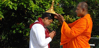 Basil Rajapaksa being blessed by Buddhist monks before swearing-in (photo Chandana Perera)