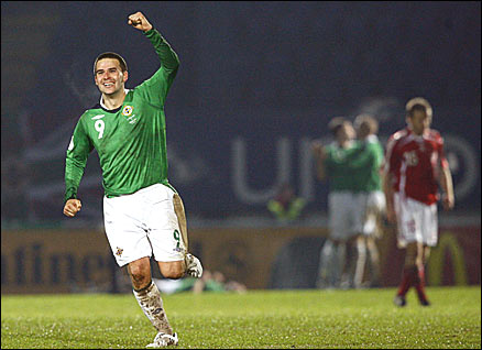David Healy celebrates following Northern Ireland's win over Denmark