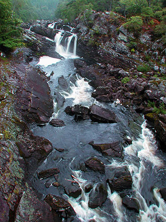 River running over rocks, photo by Tom Ang