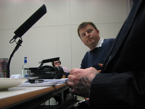 Tom listening to Brian