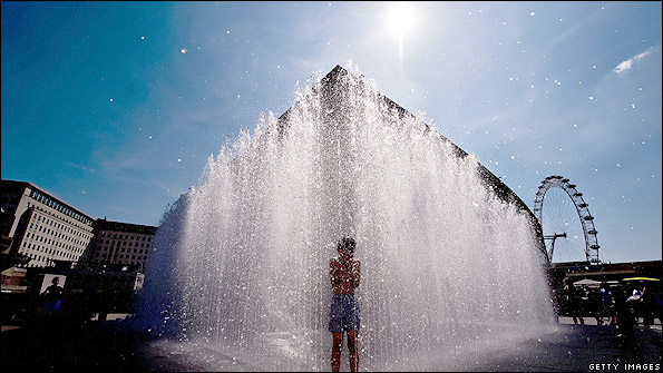 A child enjoys a fountain next to the River Thames in August 2009